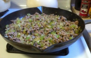 Sausage, onion, celery and parsley at work